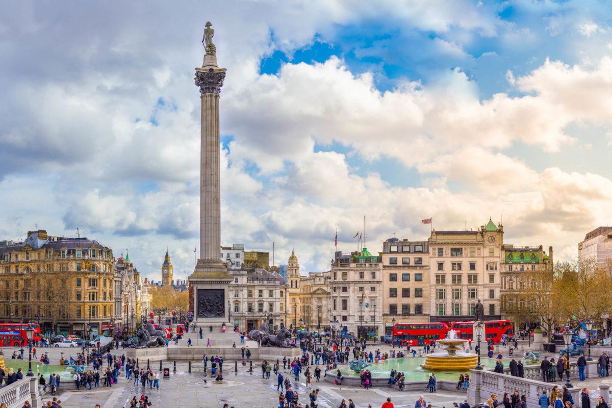 Trafalgar Square marks the vibrant centre of London, UK, at the crossroads of the major shopping streets Whitehall, The Mall and Pall Mall - © ExFlow / Shutterstock
